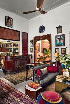 a living room filled with lots of furniture and decor