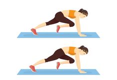 a woman doing push ups on a blue mat