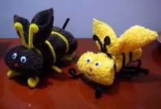 three stuffed animals sitting on top of a wooden table