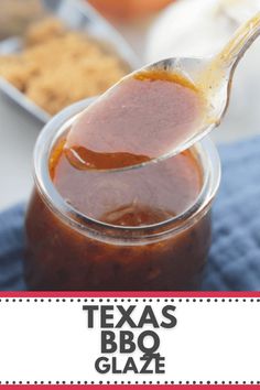 a spoon full of bbq sauce sitting on top of a blue towel with the words texas bbq glaze