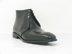 Style: 509-11-Black Handsome Calfskin lace-up Chukka Boot from the Carrucci collection features 3-Eyelet lace and a clean welt! Elegant Ankle Lace-up Boots For Derby, Elegant Black Chukka Boots For Business, Classic Lace-up Office Boots, Formal Lace-up Boots With Leather Sole, Elegant Semi-formal Chukka Boots, Elegant Lace-up Boots For Semi-formal Occasions, Formal Chukka Boots With Leather Sole, Elegant Black Chukka Boots With Plain Toe, Elegant Black Chukka Boots With Round Toe