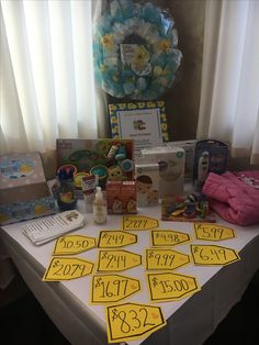 the table is covered with baby items for sale