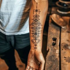 Detailed geometric forearm tattoo design in craftsman's workshop, showcasing symbols and patterns. Geometric Forearm Tattoo, Map Tattoos, Forearm Tattoo Design, Forearm Tattoos, Forearm Tattoo, Showcase Design, Tattoo On