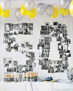 a party with balloons and pictures on the wall, including yellow and silver balloons hanging from the ceiling