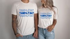 Show off your team spirit with this cute minimalist style Tampa Bay Lightning shirt. Know a lightning mega fan? This is the perfect gift for them!! THE MATERIAL: Classic unisex jersey short sleeve tee fits like a well-loved favorite.  Soft cotton and quality print.  The shoulders have taping for better fit over time.  Dual side seams hold the garment's shape for longer. 100% Airlume combed and ringspun cotton (fiber content may vary for different colors) Runs true to size Sizing: Unisex sizing (Looser fit for women) If you're looking for more of a tighter fit size down, oversize fit size up. We do not issue refunds or accept returns due to incorrect sizing, so please double-check the size before purchase. *The placement of the graphic may vary slightly to what you see on the screen, as eac Tampa Bay Lightning Shirt, Tampa Bay Lightning, Tampa Bay Rays, Color Run, Star Shirt, Tampa Bay, Oversized Fits, Jersey Shorts, Tampa