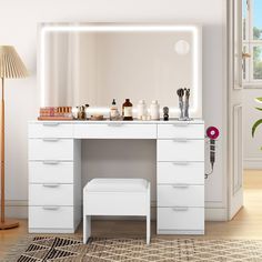 a white vanity with mirror and stool in a room