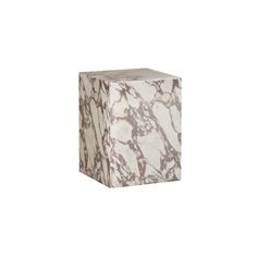 a white and brown marble block on a white background