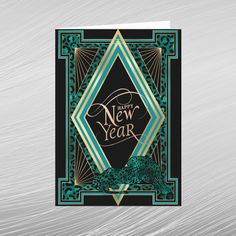 a card with the words happy new year in gold, green and blue on it