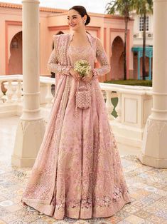 Brand: Faiza SaqlainCollection: Neorah by Faiza Saqlain Unstitched Wedding Festive Collection DESCRIPTION: Reflecting the sophistication of a floor sweeping silhouette, Ruzova is a celestial assemblage of time-honoured crafts. The powder pink net pishwas dazzles with intricately crafted tilla and sequin motifs delicately arranged in blooming floral patterns that are highlighted with every step. This piece comes with a silk churidar and an artistically adorned sheer net dupatta making it a true t Faiza Saqlain, Frock Style, Semi Formal Wear, Pakistani Wedding Dress, Embroidered Bodice, Chiffon Collection, Modest Wear, Silk Trousers, Pakistani Designers