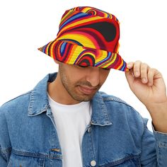 Introducing our Retro Swirls Bucket Hat, a psychedelic blend of style and comfort. This hat is crafted from 100% premium polyester that ensures durability and long-lasting use. Our Retro Swirls design, a mesmerizing pattern of swirling colors and shapes, will transport you back in time or to a different dimension. Available in two sizes, this hat features a sewn-in label for authenticity. It's not just a hat, it's a statement of bold, carefree style. Perfect for summer festivals, beach outings, Cool Bucket Hats, Carefree Style, Rave Gear, Summer Festivals, Swirl Design, Bucket Hats, Summer Festival, Back In Time, Festival Outfits