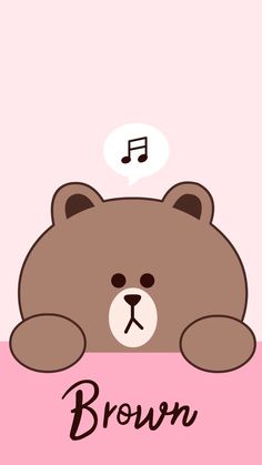 a brown teddy bear sitting on top of a pink surface with music notes above it