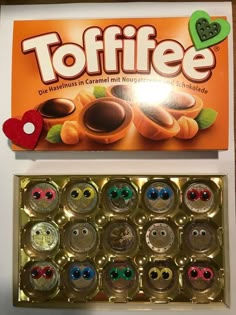 a box of toffee chocolates next to the package