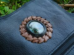 Check out our amazing Gemstone Belt Bag, where style meets practicality! Handmade from genuine brown leather, each bag is a one-of-a-kind treasure. You can see the quality in every little detail, from the hand-stitched finish to the eye-catching gemstone centerpiece. This belt bag is perfect for anyone who loves to dance and keep their hands free at festivals. It comes in three awesome colours: Black, Dark Brown, and Light Brown. The adjustable belt fits waist sizes from 38 to 42 inches (98 to 1 Handmade Nature-inspired Travel Bag, Nature-inspired Handmade Shoulder Bag For Everyday Use, Handmade Nature-inspired Bag For Daily Use, Handmade Nature-inspired Everyday Shoulder Bag, Everyday Handmade Nature-inspired Shoulder Bag, Nature-inspired Handmade Bags For Everyday Use, Gemstone Belt, Leather Making, Handmade Leather Belt