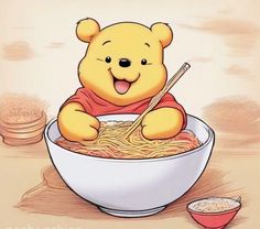 winnie the pooh is eating noodles in a bowl with chopsticks on it