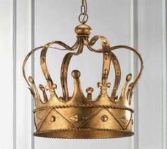 a gold crown hanging from the ceiling