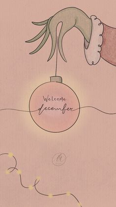 a pink christmas ornament with the words welcome december hanging from it's side