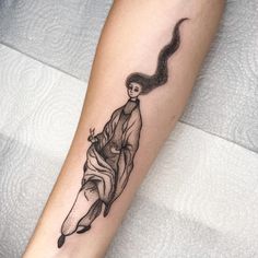 a woman's arm with a tattoo on it