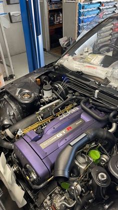 the engine compartment of a car is shown in this image, and it's purple