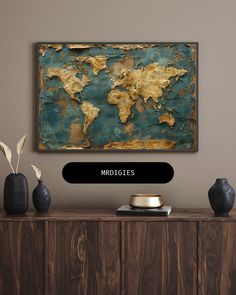 an old world map is displayed on the wall above a wooden cabinet with vases