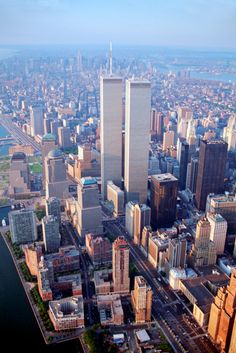 an aerial view of the twin towers in new york city, with caption that reads click here to book tour now