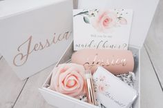 a white box with pink flowers and personalized items