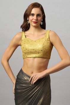 Product Features: Color: Gold Fabric: Net Neck Style: Round Neck Sleeve Length: Sleeveless Closure: Back Padded: Yes Occasion: Festivewear, Casual Product Type: Blouse Disclaimer: There will be slight difference in digital to actual image Sleeveless Saree Blouse, Sleeveless Saree, Bridesmaid Sarees, Reception Sarees, Sleeveless Blouse Saree, Formal Saree, Ruffle Saree, Kalamkari Saree, Gold Fabric