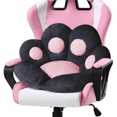 a pink and white office chair with a stuffed animal on it