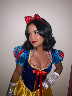 a woman dressed as snow white posing for the camera