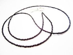 This simple black lightweight seed bead lanyard is a perfect way to keep your work or school id close at hand. The seed beads measure 2mm. SMALL- measures 30" and will hang approximately 17" from the back of the neck to the bottom of the clip.MEDIUM- measures 33" and will hang approximately 18.5" from the back of the neck to the bottom of the clip.LARGE- measures 36" and will hang approximately 20" from the back of the neck to the bottom of the clip.Lanyard is made with durable multi-strand coat Seed Bead Lanyard, Bead Lanyard, Lanyard Id Holder, Black Lanyard, School Id, Beaded Lanyards, Beading Wire, Id Badge Holders, Badge Holder