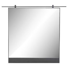 a square mirror hanging on the wall