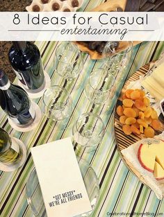 a table topped with wine glasses and cheese