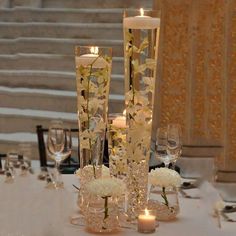 the centerpieces are decorated with flowers and candles