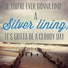 a quote on the beach saying if you're ever going find a silver lining, it's gotta be a cloudy day