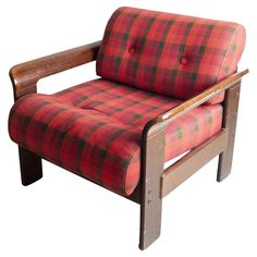 a red and black plaid chair with wooden legs