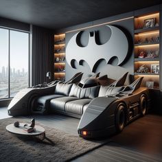 a batman themed bedroom with the bed made to look like a batmobile and built - in bookshelves