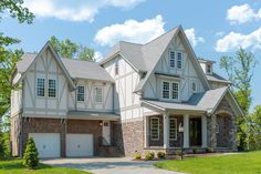 a large house with lots of windows on the front