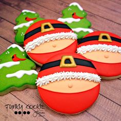 decorated cookies in the shape of santa claus