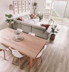 a living room filled with furniture and a wooden table