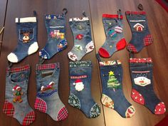 twelve pairs of christmas socks are laid out on a table