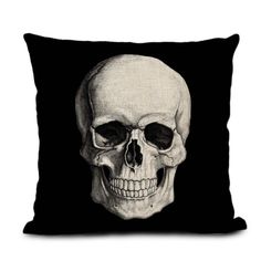 a black pillow with a white skull on it