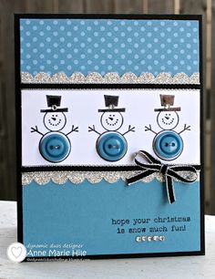 a close up of a card with buttons and snowmen on the front, which reads happy your christmas is now much fun