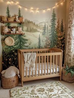 a baby's room decorated with trees and lights