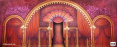 an image of a stage set with red curtains and gold trimmings on it