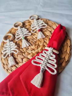 a basket with some red napkins on top of it and a skeleton decoration in the middle