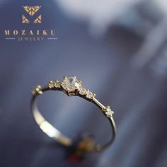 "Our absolute favorite -- Mozaiku's 7 Rocks, Gold Or Sliver Ring - is this gorgeous Japanese inspired Fine Band Ring that will add that sophisticated edge to any outfit, as it's so noticeably small yet striking. You can get it in 14kt plated yellow gold or S925 silver, featuring 7 diamond-cut zircon stones. Specification:      Material - 925 silver     Plating -14 k gold     Stones - Zircon diamonds     Color - Gold, silver white     Made by mozaiku      Custom made to order NEW STORE OPENING 8 WEEKS EXCLUSIVE OFFER. LIFETIME WARRANTY  Time and time again, we come across products that break the next day after you buy them.  That's not going to happen for you at our store, Mozaiku.  You can buy Mozaiku with peace of mind knowing that we will fix anything that happens to our jewels.  We are Gold Sterling Silver Solitaire Crystal Ring, Gold Solitaire Crystal Ring In Sterling Silver, Gold Sterling Silver Crystal Wedding Ring, Gold Sterling Silver Crystal Ring For Wedding, Sliver Ring, Store Opening, Diamond Gold, Diamond Cut, Gold Wedding