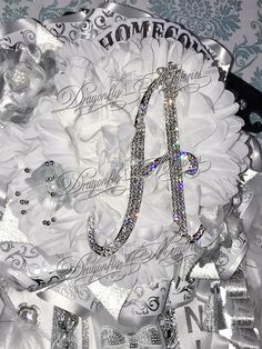 the monogrammed wedding bouquet is adorned with swarozak crystals and ribbon