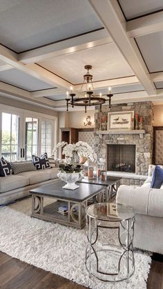 a living room filled with furniture and a fire place in the middle of a room