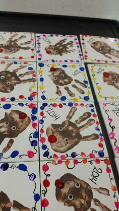 four matching game boards with different pictures of hands and fingers on them, all decorated in multi - colored dots