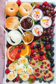 an assortment of fruits and pastries on a platter