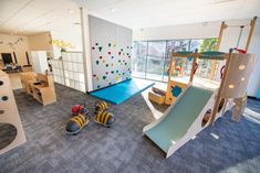 children's play area with slides and climbing walls